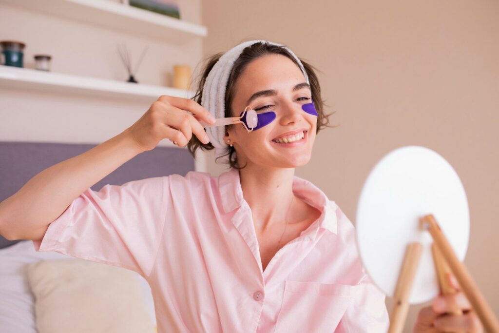 a woman in a pink shirt holding a pair of scissors