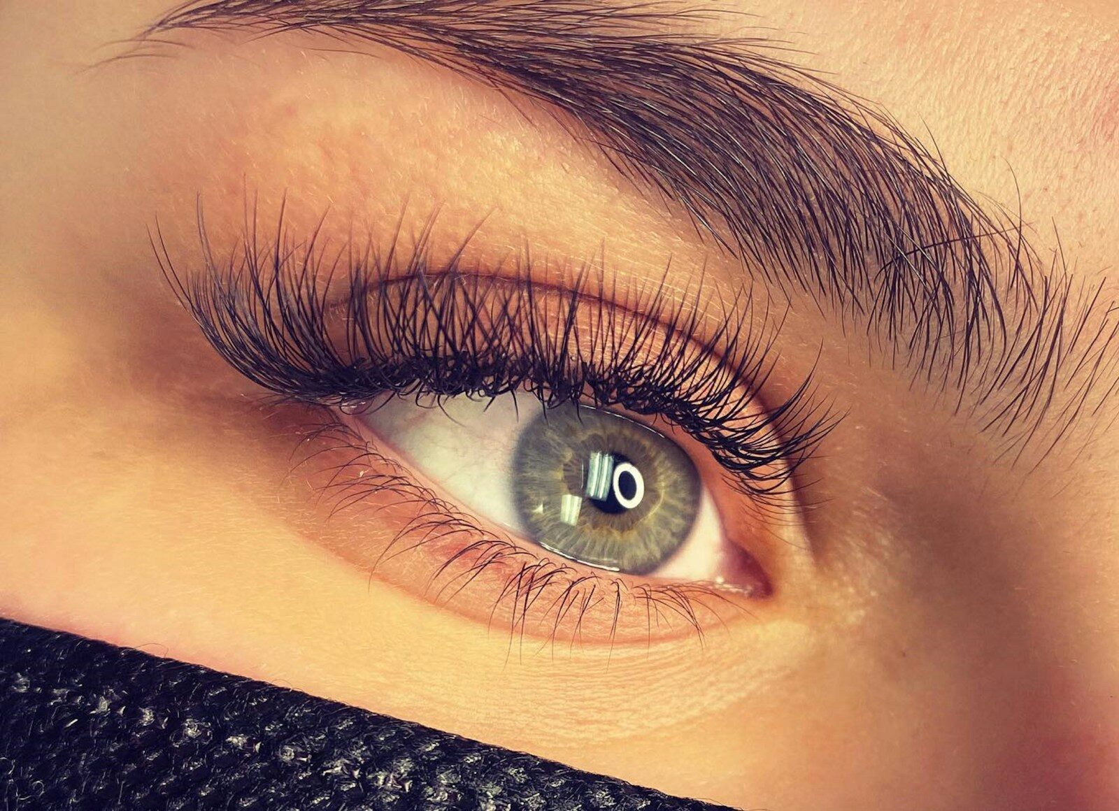 close up of a person's eye with long lashes
