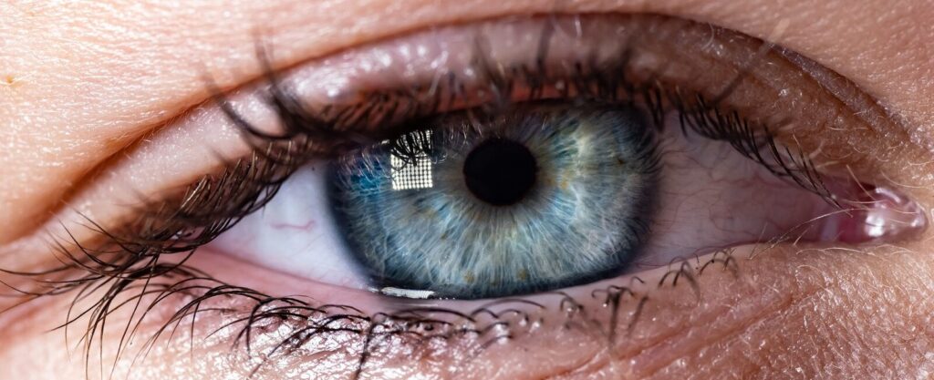 a close up of a person's blue eye